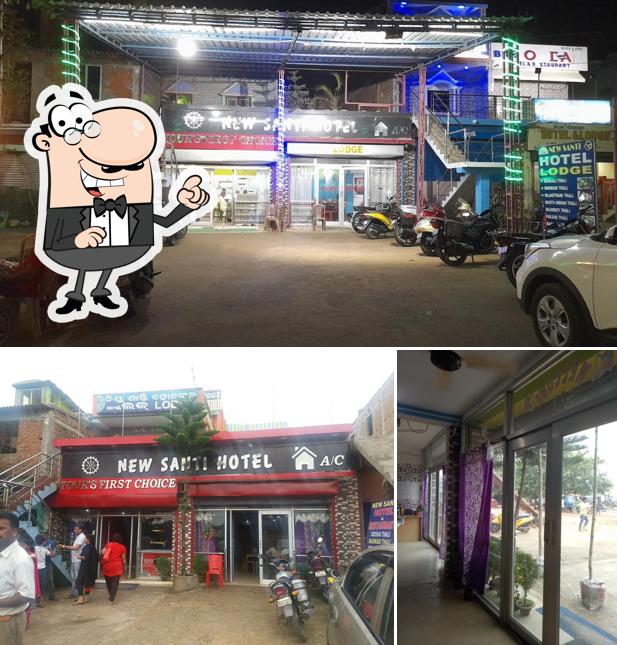 Take a seat at one of the tables at NEW SANTI HOTEL