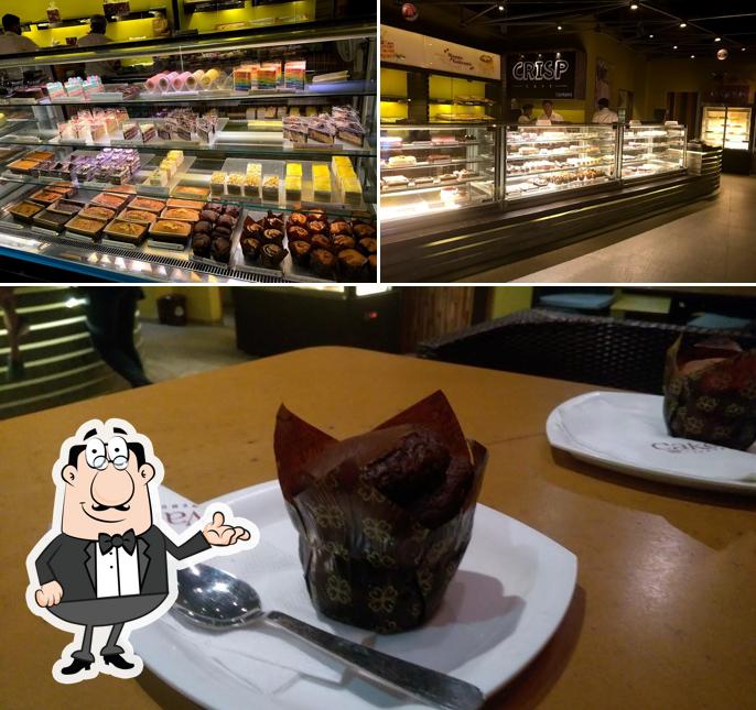 Take a seat at one of the tables at Cake Walk ಕೇಕ್ ವಾಕ್