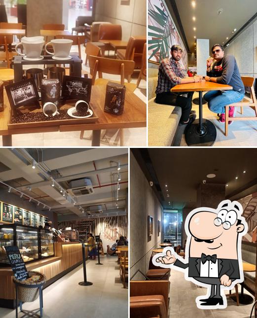 Take a seat at one of the tables at Starbucks Coffee