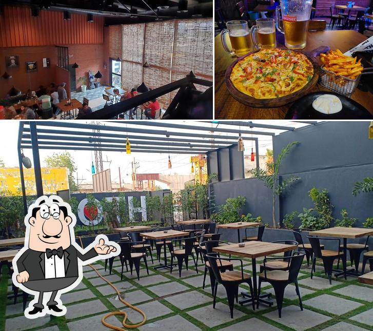 Among various things one can find interior and pizza at FROTH - The Cafe Bar