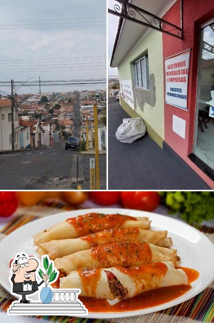 A imagem da exterior e comida a Marmitaria Dona Maria