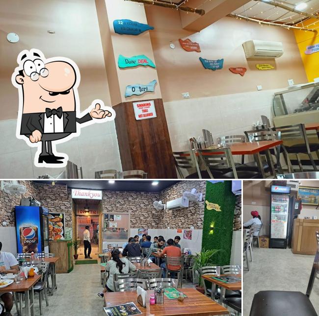 Take a seat at one of the tables at Punjabi Dhaba