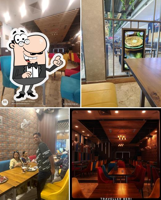 Take a seat at one of the tables at Udupi Krishna Restaurant
