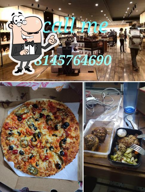 Take a look at the image showing interior and pizza at Burgzooka