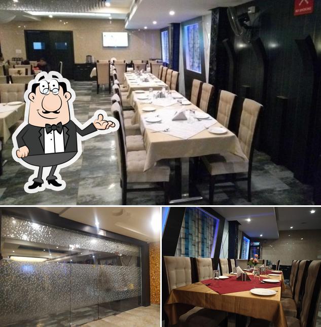 Take a seat at one of the tables at Swaad Restaurant