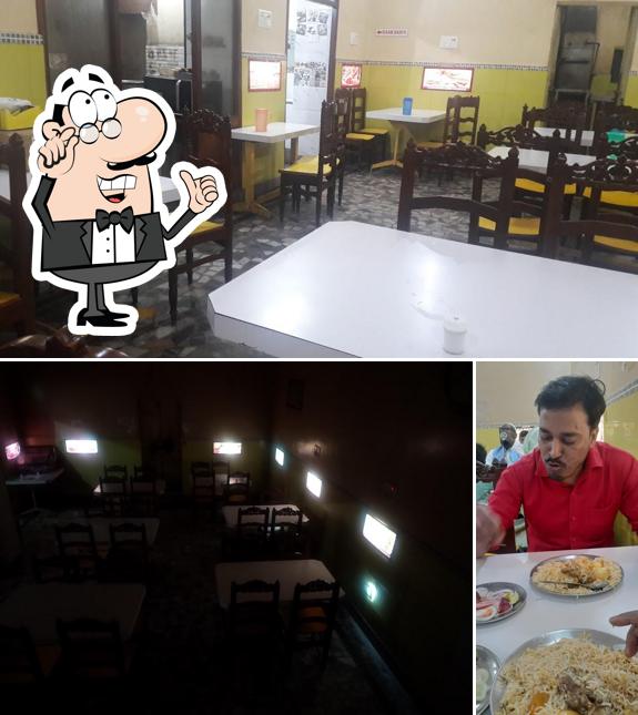 Take a seat at one of the tables at Taj Hotel