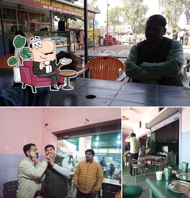 Take a seat at one of the tables at JANTA DHABA