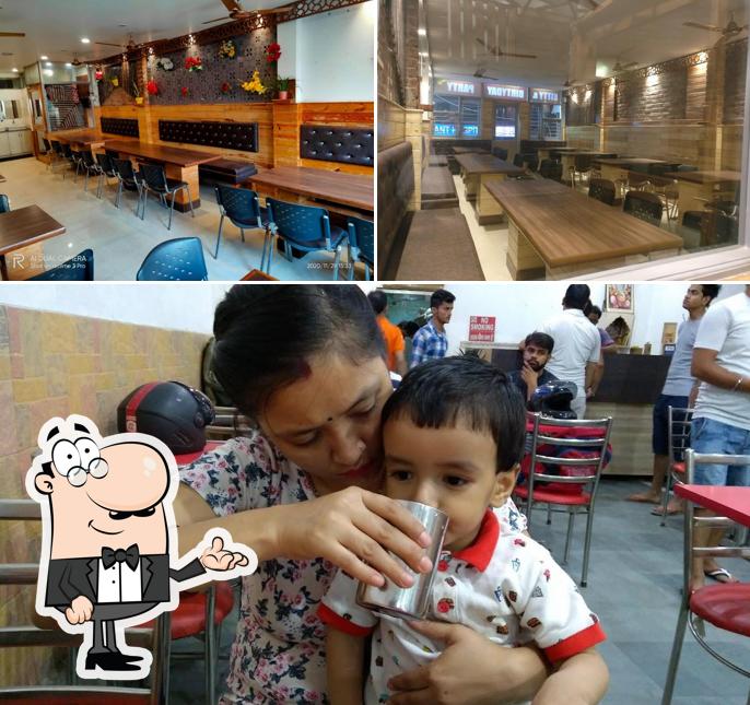 Take a seat at one of the tables at Mezbaan Family Restaurant