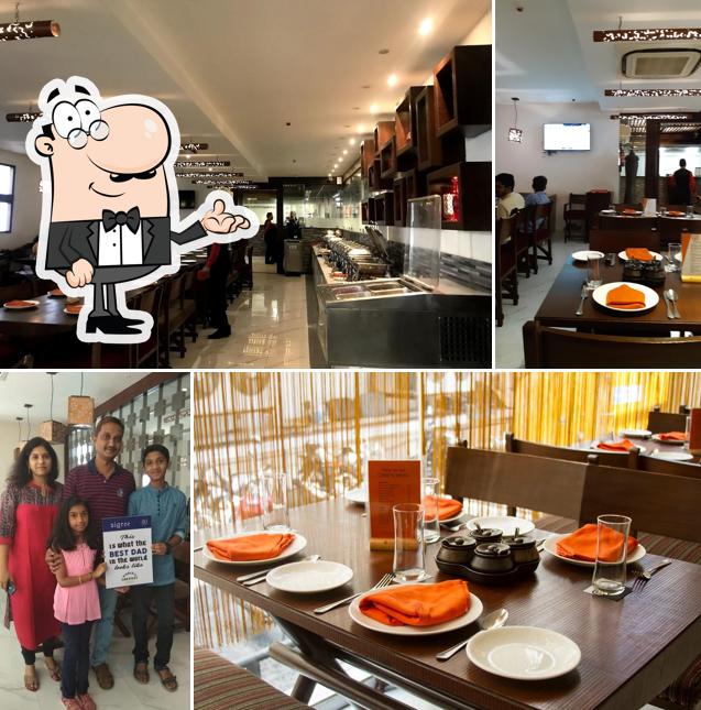 Take a seat at one of the tables at Sigree Annanagar