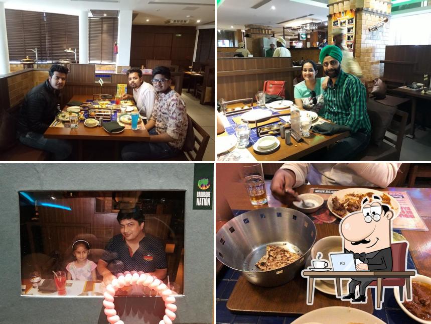 Take a seat at one of the tables at Barbeque Nation