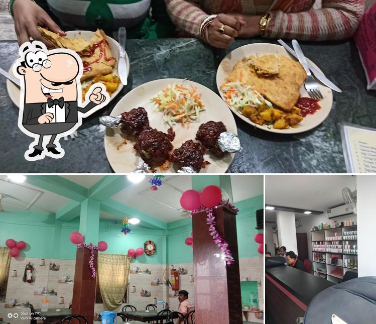 Check out the image displaying interior and food at Haldia Bhoj
