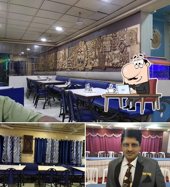 Take a seat at one of the tables at Arya Bhawan