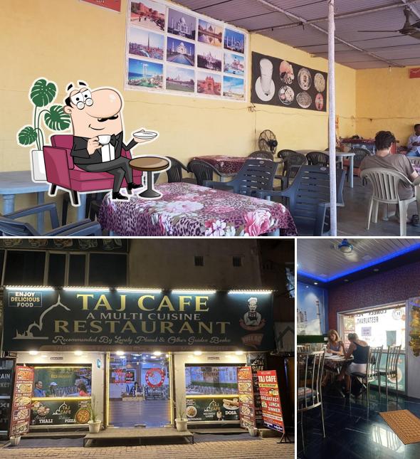 Take a seat at one of the tables at Taj Cafe Restaurant A/C ROOF TOP