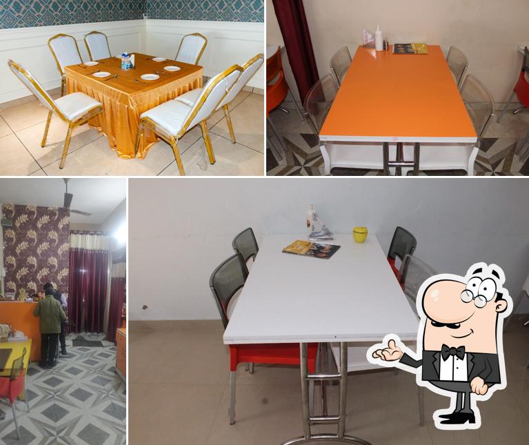 Take a seat at one of the tables at Grill Hut Junction
