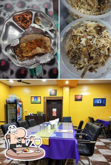 Take a look at the image showing food and interior at The Kitchen