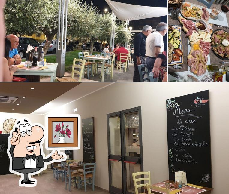 Dai un'occhiata agli interni di Accussì è Pizzeria Ristorante