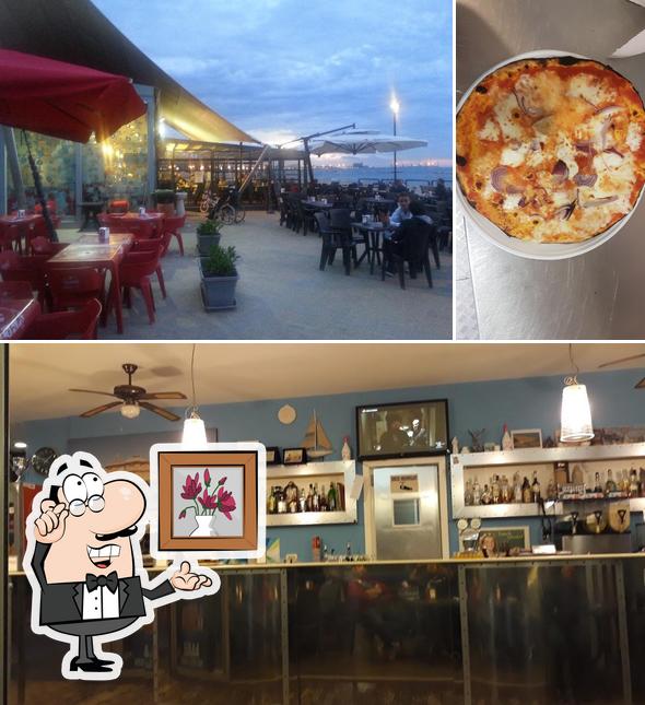 Tra le diverse cose da Bar Pizzeria Pane e Pomodoro si possono trovare la interni e pizza