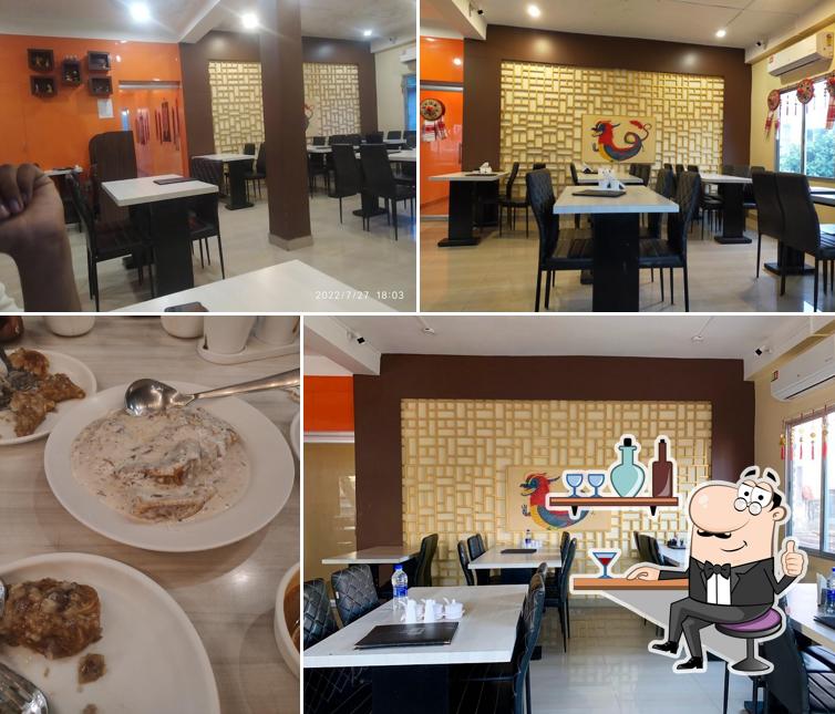 Take a seat at one of the tables at Fat Belly, Tinsukia