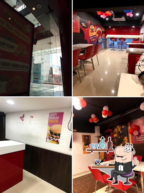 Take a seat at one of the tables at GRILL INN AMBALA