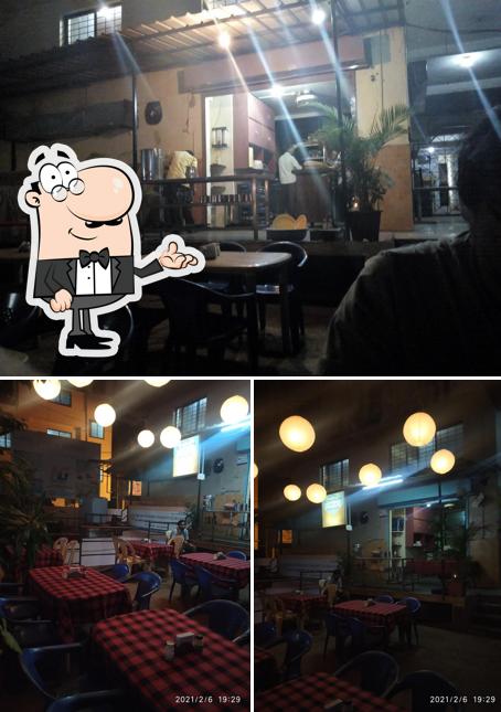 Take a seat at one of the tables at Hotel Guru Krupa family restaurant