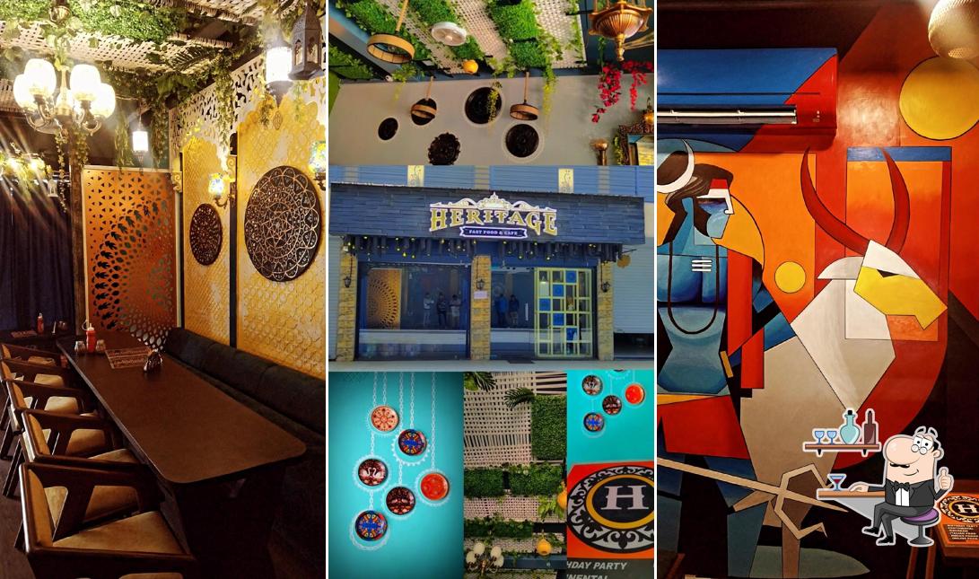 Take a seat at one of the tables at HERITAGE CAFE & FASTFOOD