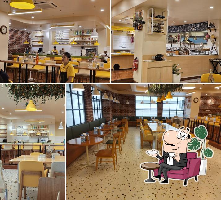 Take a seat at one of the tables at Boarding Pass Restaurant (Bloom Hub ORR)