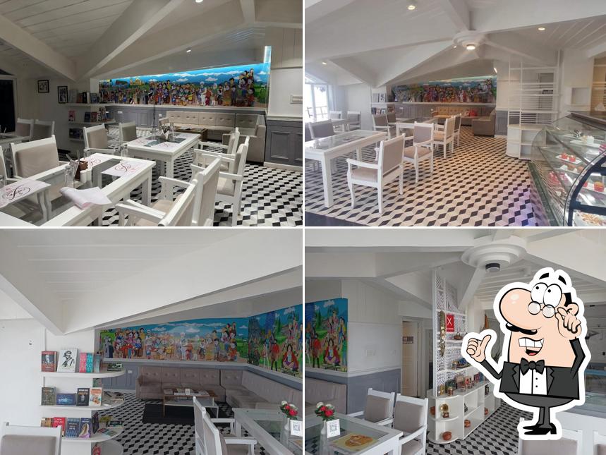 Take a seat at one of the tables at Cafe House by The Retreat Darjeeling