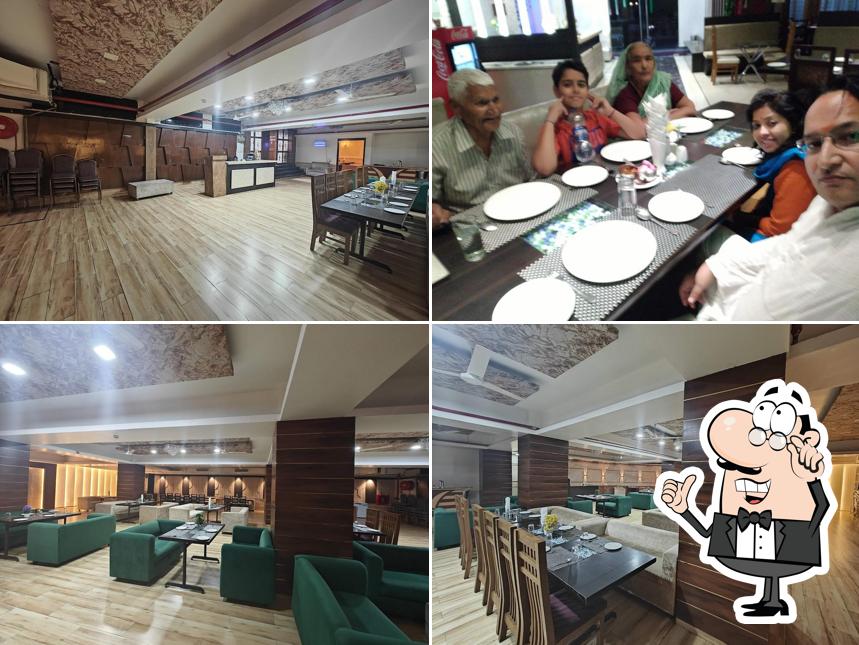 Take a seat at one of the tables at DINING INN HOTEL & RESTAURANT