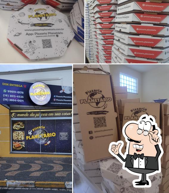 O interior do Pizzaria Planetário - Mogi Mirim
