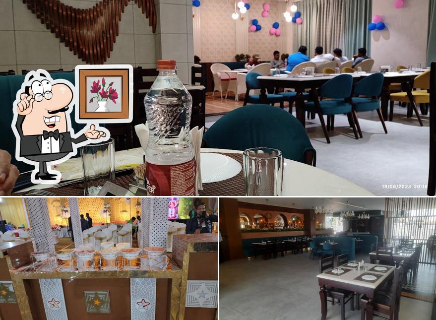 Take a seat at one of the tables at Vatika Sweets Bakery and Restaurant