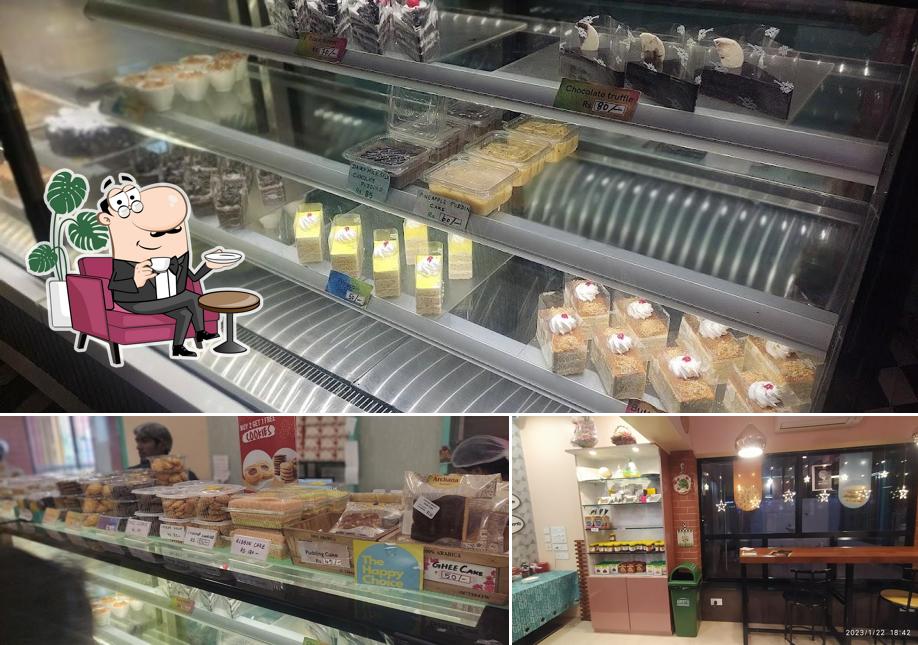 Take a seat at one of the tables at Archana Sweets Bakery & Cafe