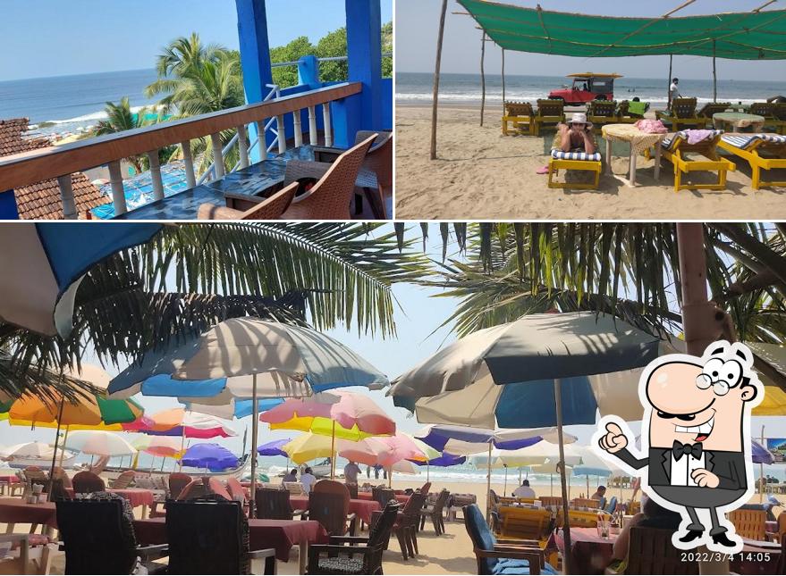 Take a seat at one of the tables at Red Rock Arambol Beach