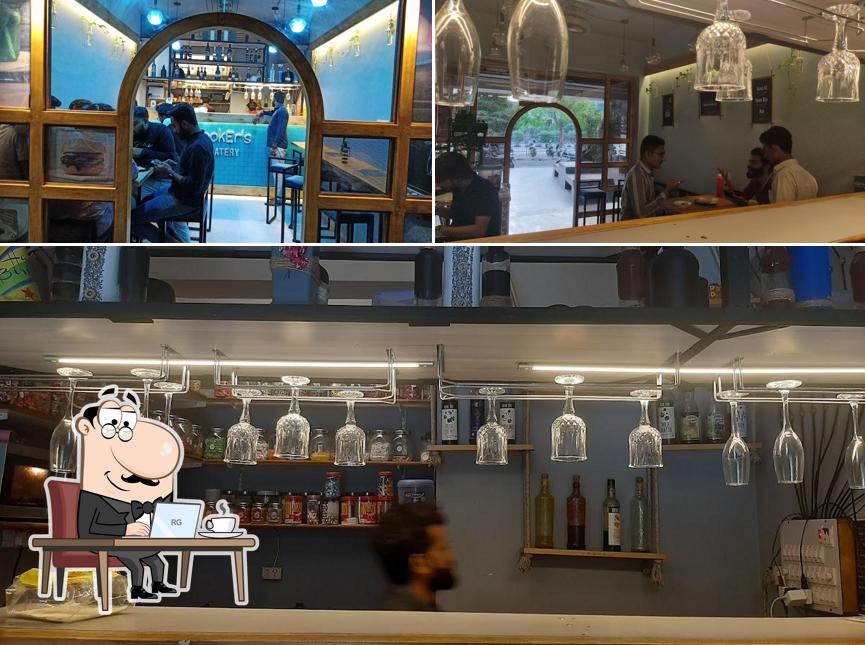 Take a seat at one of the tables at CookEr's Eatery best cafe in varachha