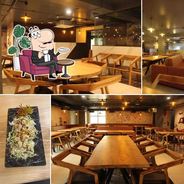 Take a seat at one of the tables at Oishii Pan Asian Fine Dining