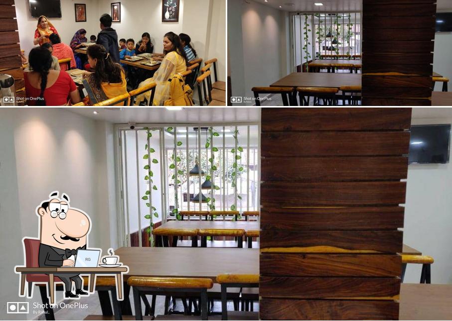 Take a seat at one of the tables at Shree Balaji Pure Veg