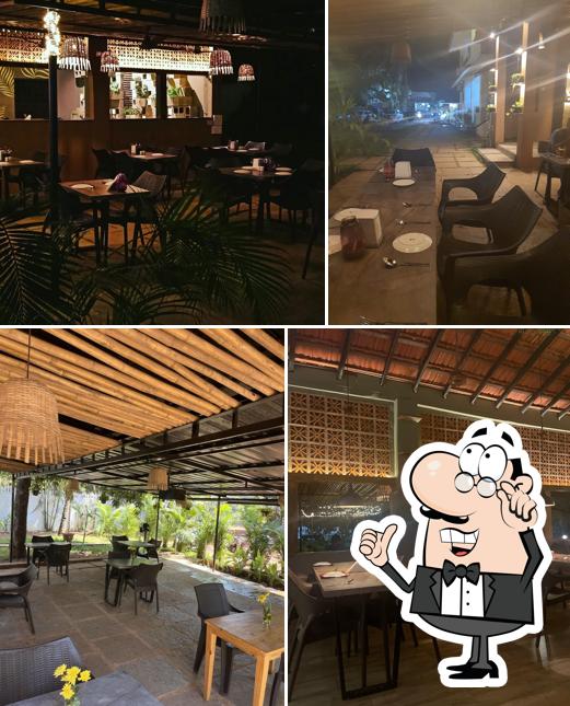 Take a seat at one of the tables at Trisara Kitchen & Bar