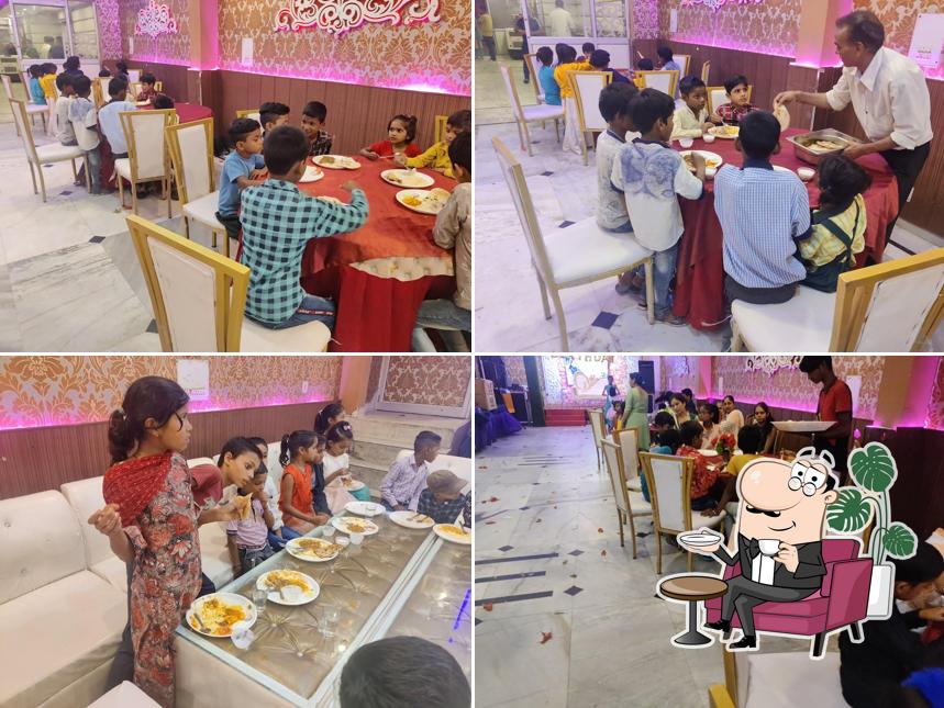 Take a seat at one of the tables at Sagar Restaurant