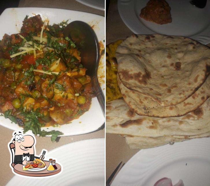 Get pizza at Pragati Restaurant