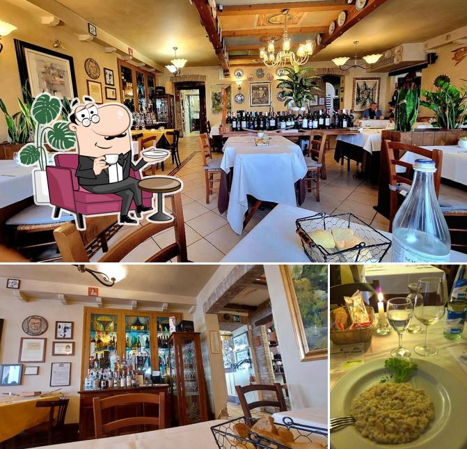 Antica Trattoria Alla Fossetta si caratterizza per la interni e tavolo da pranzo