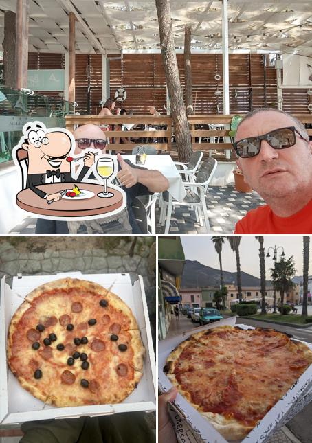 La immagine della cibo e interni di Pizza Pazza a Pezzi