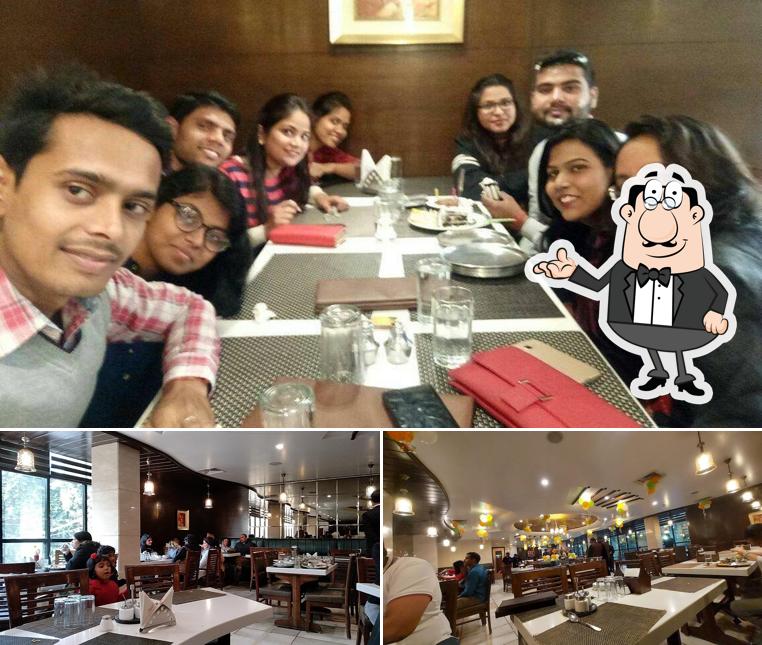 Take a seat at one of the tables at Sagar Ratna Pure Veg Restaurant