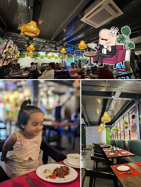 Take a seat at one of the tables at Sitara Restaurant best biriyani in nellore best restaurant best multi-cuisine restaurant