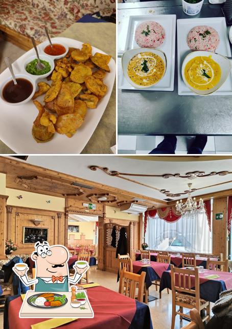 La immagine di cibo e interni da Ristorante Pizzeria Ristorante Indiano Ai Canopi