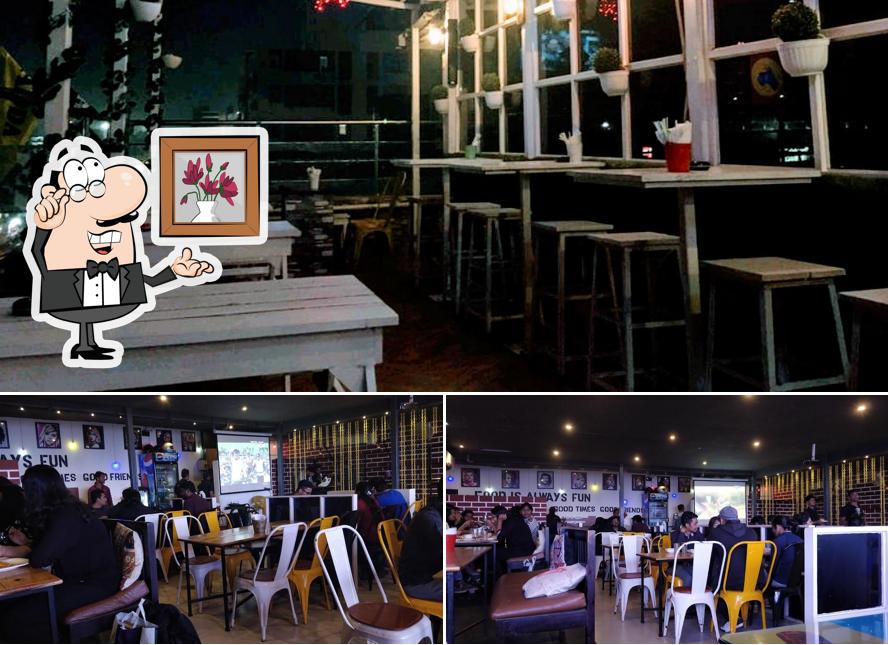 Take a seat at one of the tables at Adda Cafe