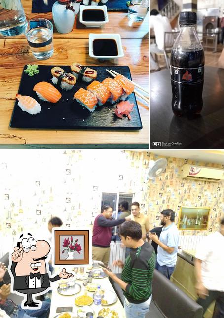 Check out the photo displaying interior and beverage at Jal Tarang Dhaba & Family Restaurant