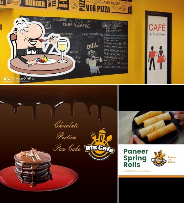 This is the picture showing food and blackboard at RTS Cafe Aligarh