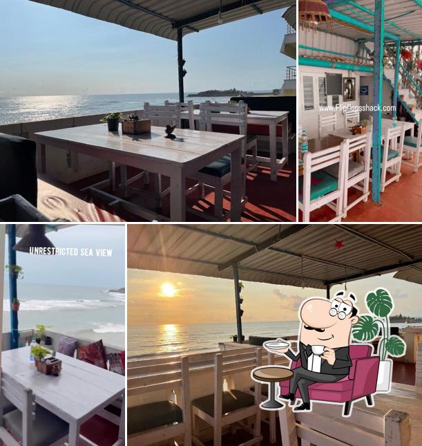 Take a seat at one of the tables at Flip Flops Beach Shack & Cafe