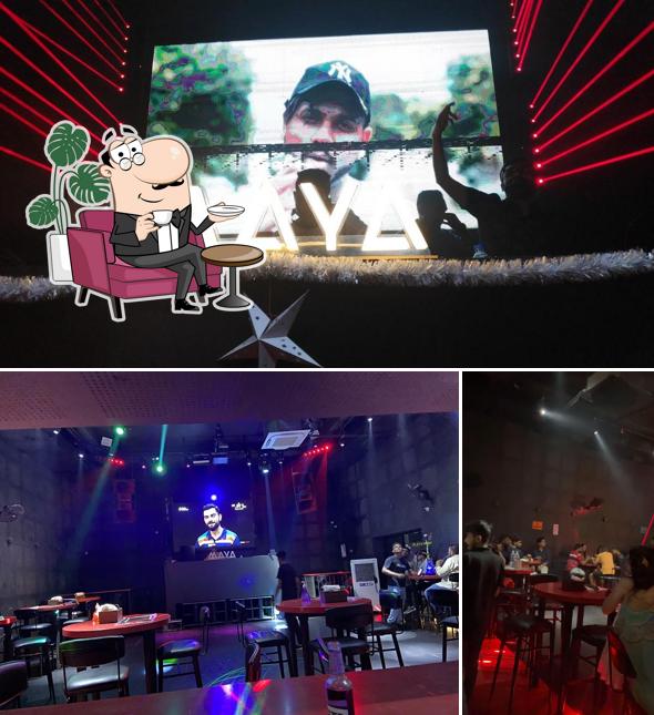 Take a seat at one of the tables at Maya Nightclub By Ws