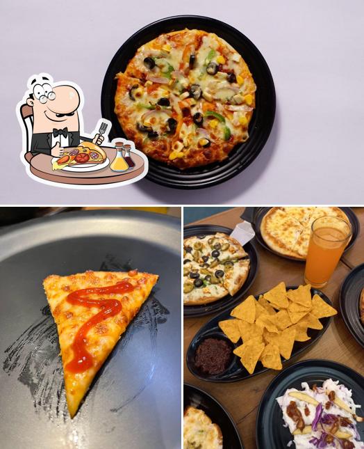 Try out pizza at William John's Pizza Naranpura