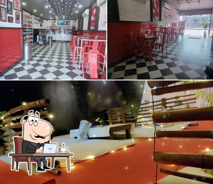 Take a seat at one of the tables at The Dark Fusion Cafe